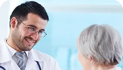 Doctor consulting with elderly patient